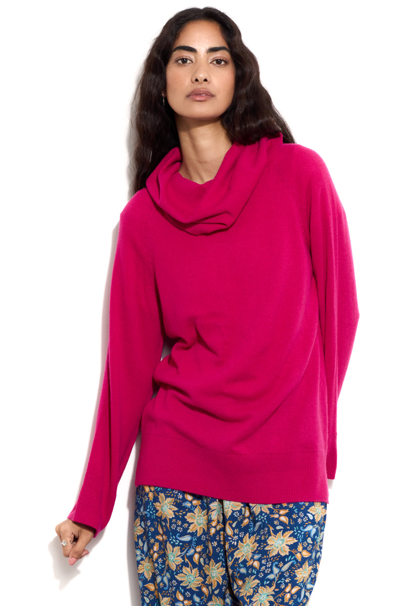 Model wears EAST Ruhn Pink Cashmere Roll Neck Jumper