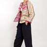 Model wears East Heritage Dayse Stone Woven Cotton Pom-Pom Jacket