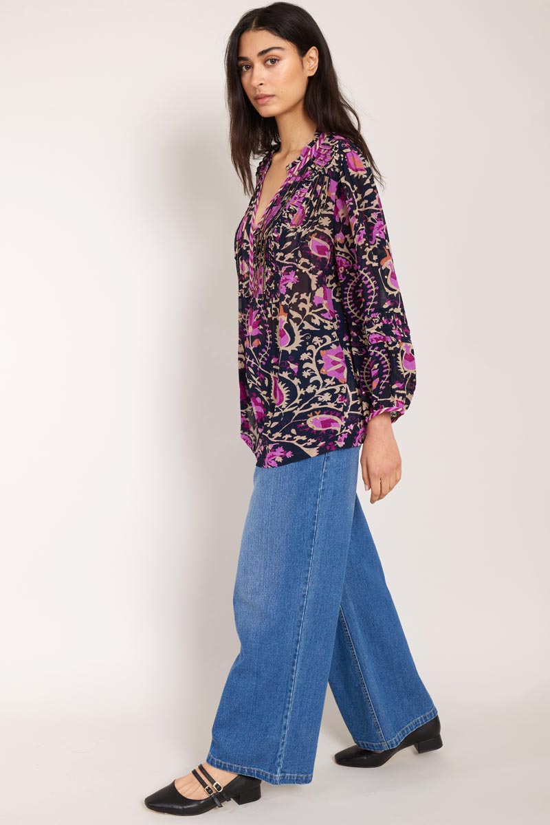 side view of model wearing Lanya pintuck blouse