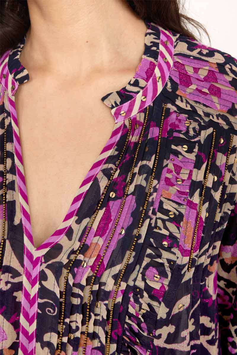 Close up image of model wearing Lanya Pintuck Blouse in navy, showing beading detailing