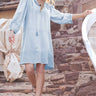 Model wears East Heritage Nia Embroidered Tunic Dress