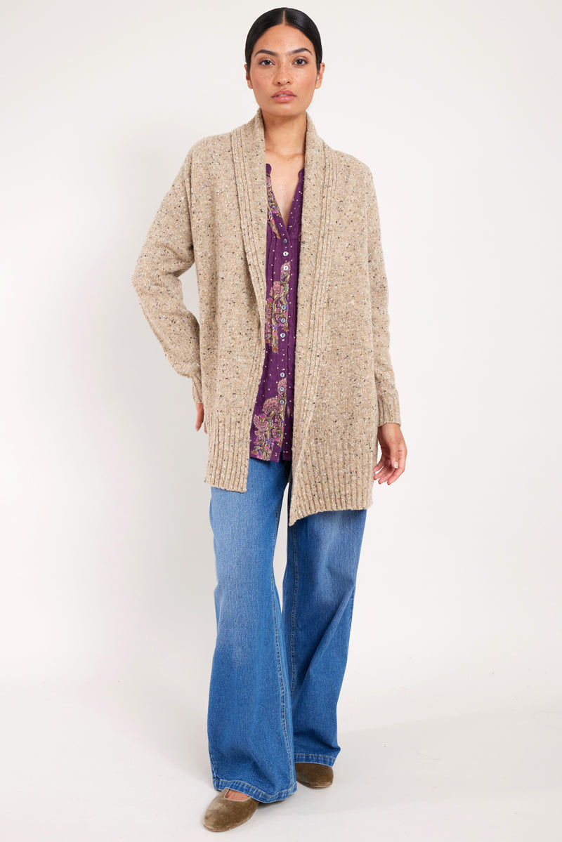 Model wears oat longline knit cardigan