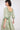Model wearing Harriet Green Organic Cotton Belted Dress by East.co.uk