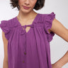 Model wearing Leia Frill Sleeve Plum Cotton Top by East.co.uk