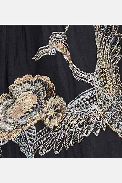 Detail view of the silver and gold bird embroidery on the beverley jumpsuit