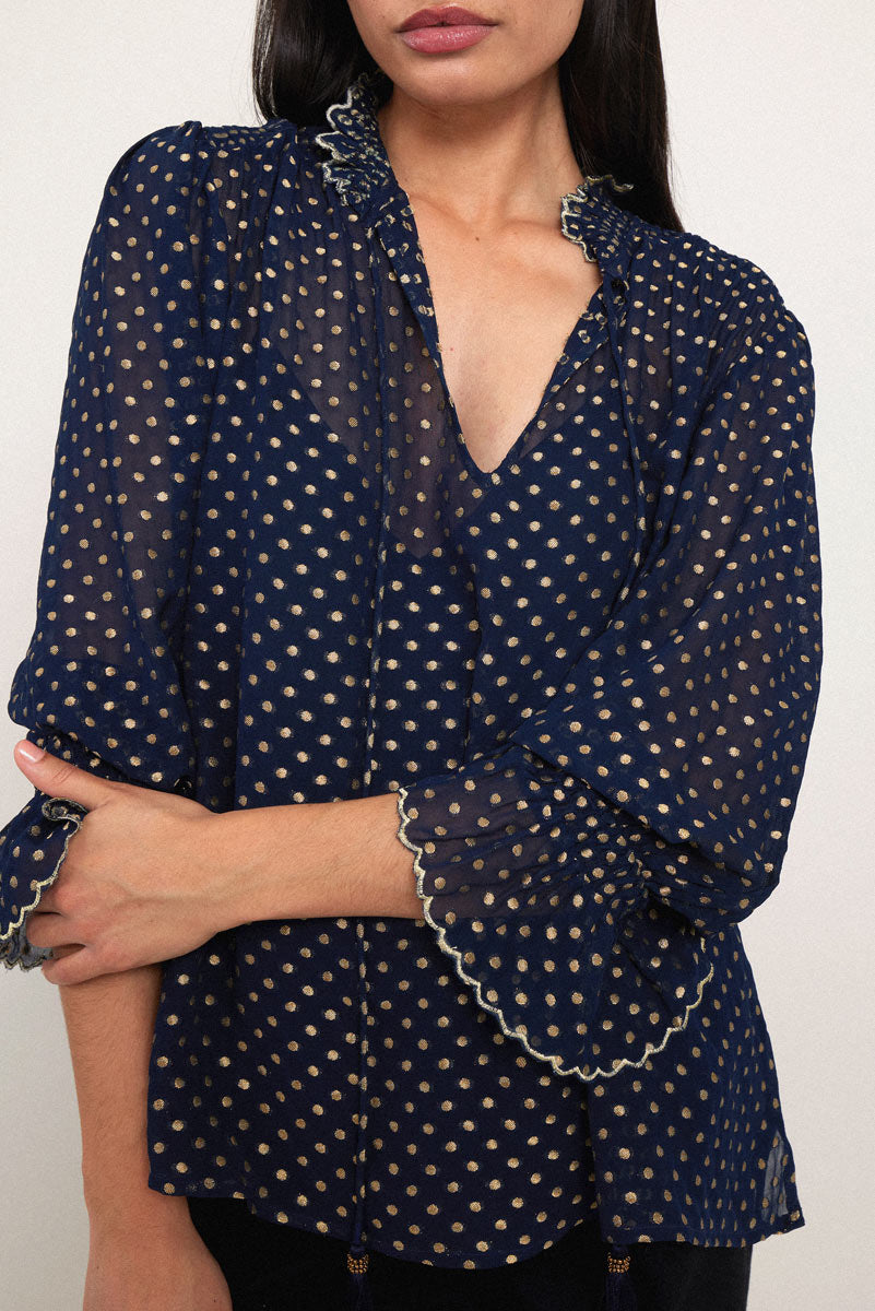 Model wears East Heritage Polina Gold Spot Top.