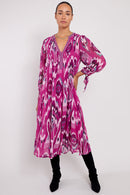 Model wears Kayleigh Raspberry Georgette Dress by east.co.uk