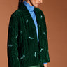 Model wears Aneesa Quilted Velvet Green Embroidered Jacket by east.co.uk