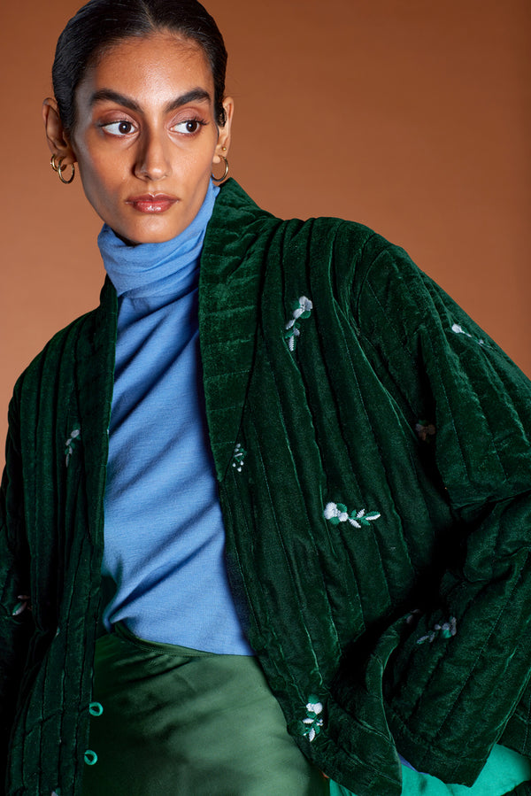 Model wears Aneesa Quilted Velvet Green Embroidered Jacket by east.co.uk