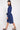 Side view of model wearing East Heritage Harlow Navy Tunic Dress