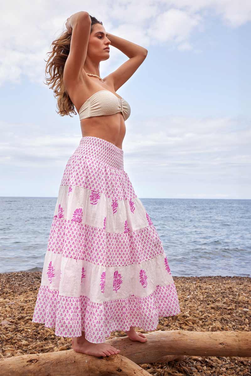 Side view of model wearing East Heritage Gigi White Cotton Tiered Skirt