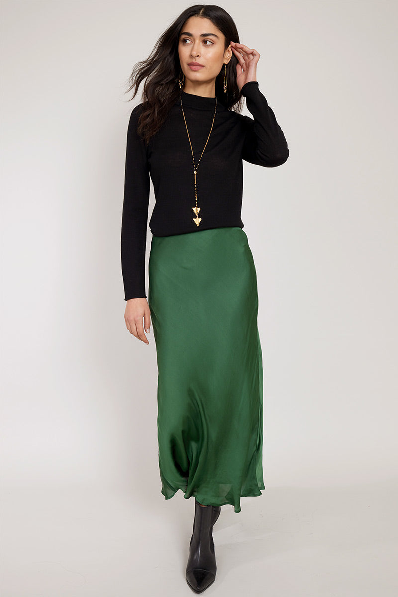 Model wears Noelle Satin Green bias cut Skirt