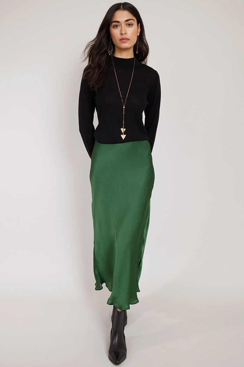 Model wears Noelle Satin Green bias cut Skirt