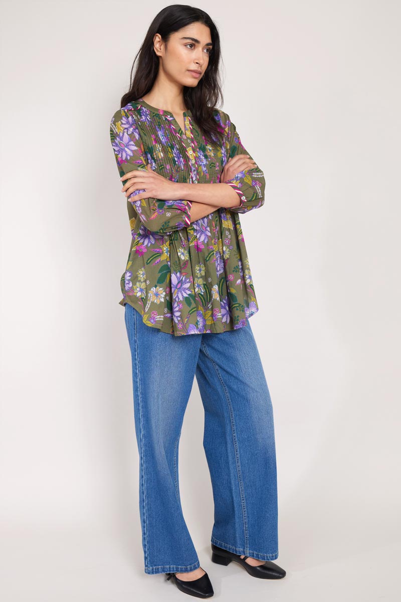 front shot of model wearing Ophelia Floral Pintuck Blouse with hands crossed over body