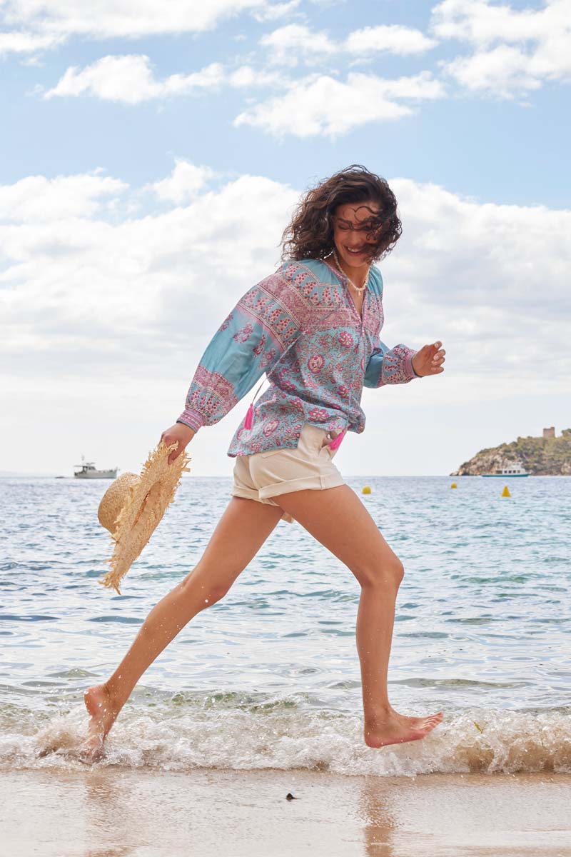 Model wears East Souki BCI Cotton Top running on the beach