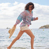 Model wears East Souki BCI Cotton Top running on the beach
