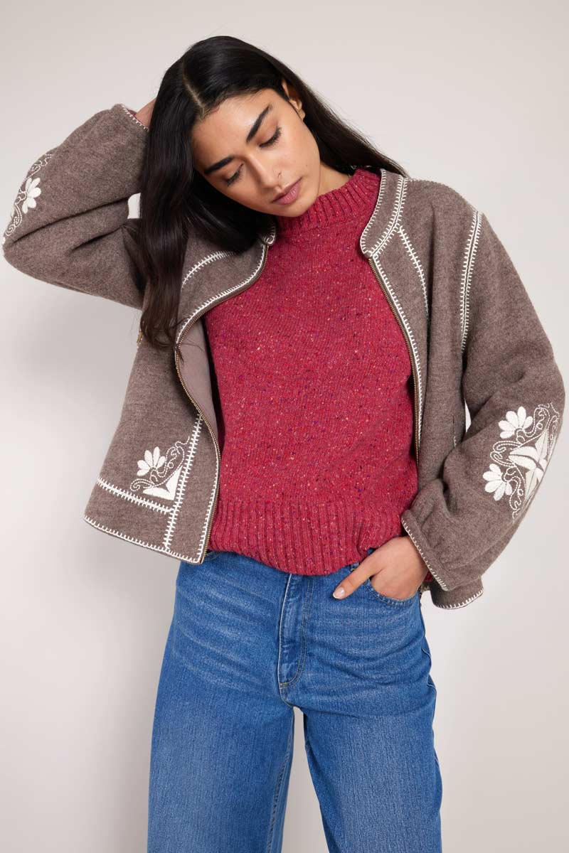 front view of model with hand in pocket, wearing East wool bomber