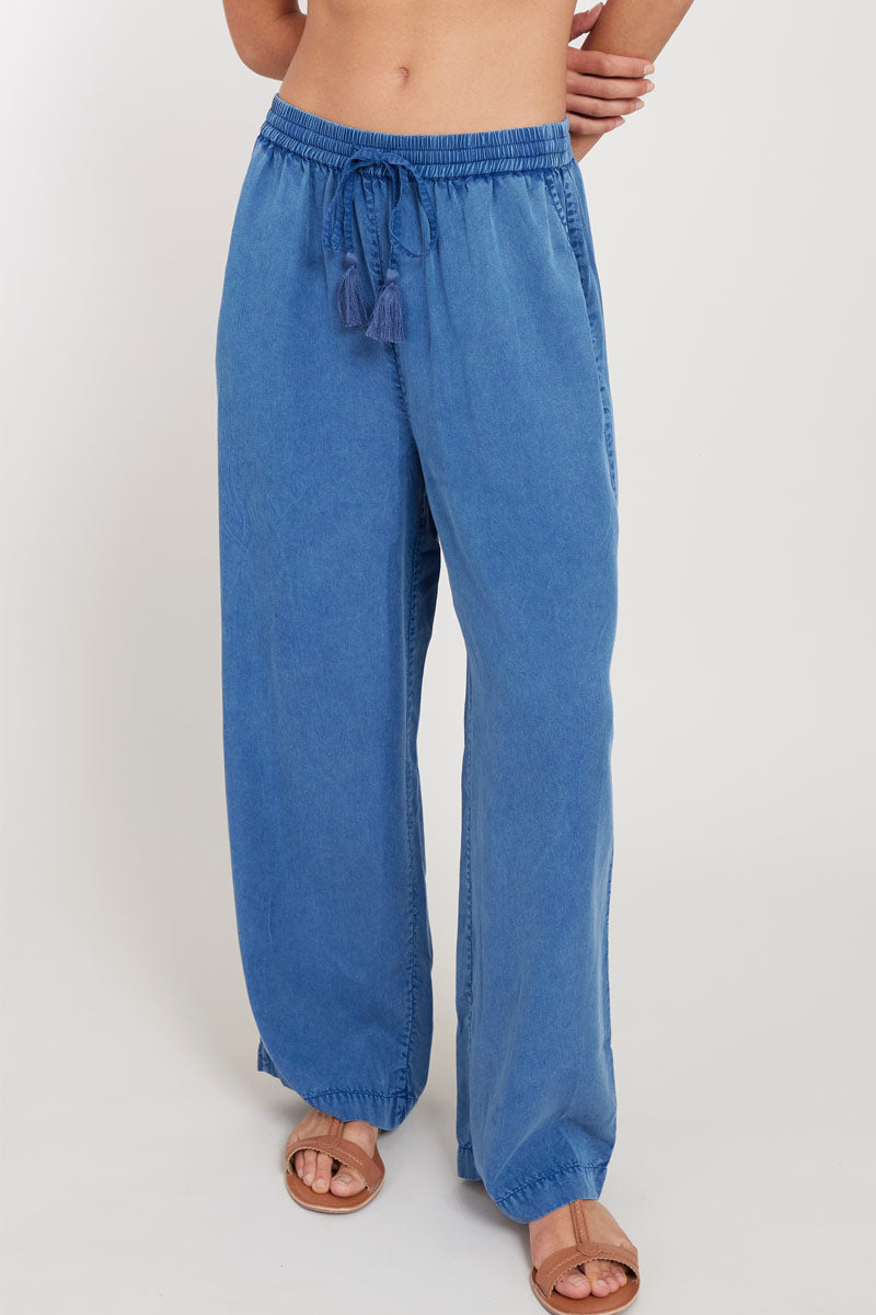 Close up of model wearing East Tessa Trousers in Blue