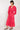 Model wears Hera Fuchsia Organic Cotton Gauze Dress