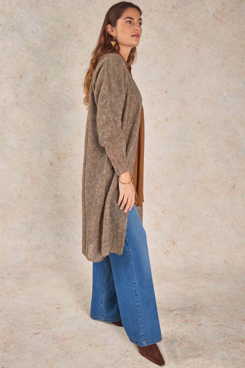 Model wears Michele & Hoven Clipper Alpaca Cardigan, full length side view