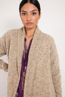 Model wears oat longline knit cardigan